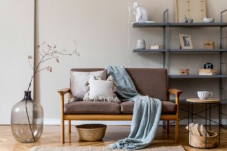 Modern interior design of living room with brown wooden sofa.